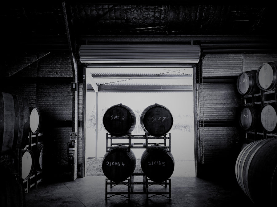 View of wine barrels from inside the Hunter Wine Lab winery